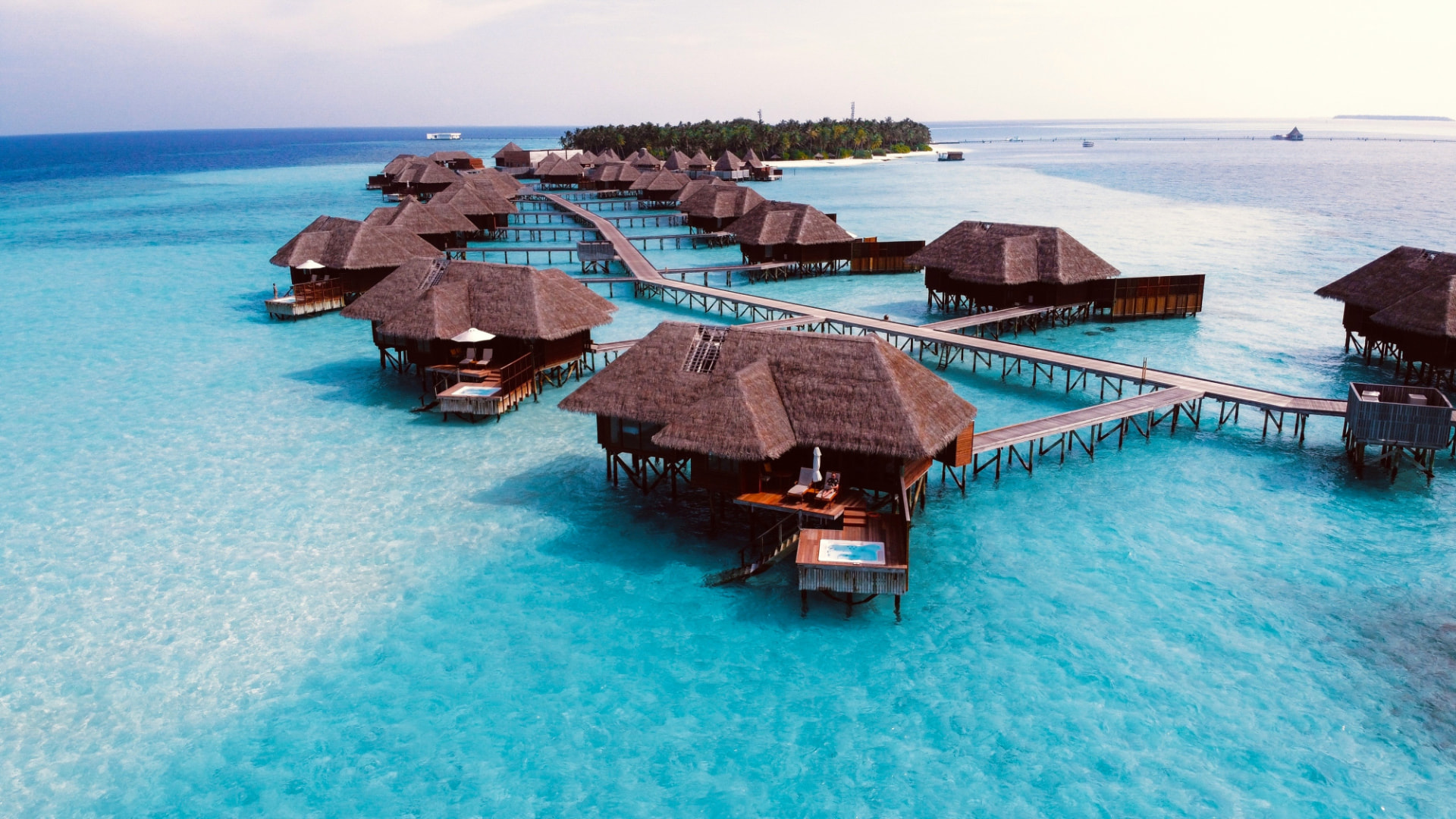 Overwater villas on a turquoise lagoon in the Maldives