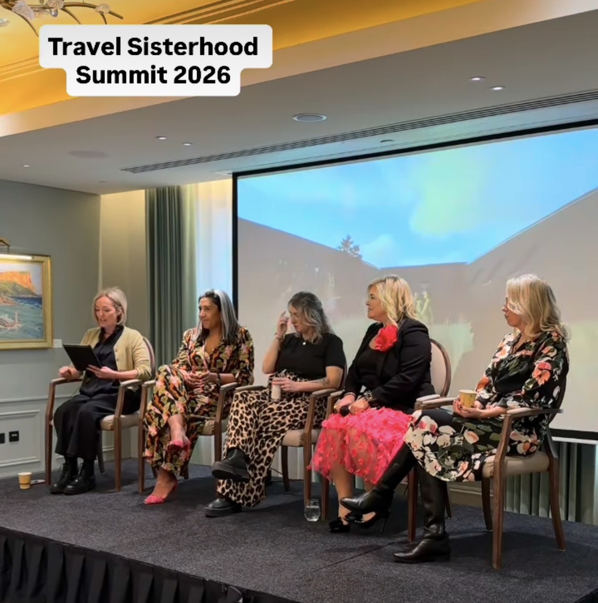 A panel of Travel Sisterhood members speaking at the Travel Sisterhood Summit